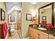 Well-lit bathroom featuring a granite countertop, a shower, and tiled floors at 517 Kingsdown Ct, Waxhaw, NC 28173