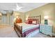 Cozy bedroom with a decorative bed frame, vintage furniture, and soft carpet at 517 Kingsdown Ct, Waxhaw, NC 28173