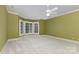 Spacious bedroom with neutral carpet, white trim and a bay window with shutter blinds at 517 Kingsdown Ct, Waxhaw, NC 28173
