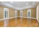 Large bonus room with hardwood floors, multiple windows, and neutral paint at 517 Kingsdown Ct, Waxhaw, NC 28173