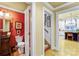 Hallway with a bathroom entrance on the left and a view of the kitchen straight ahead at 517 Kingsdown Ct, Waxhaw, NC 28173