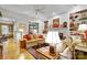 Bright living room features built-in bookshelves, a fireplace, and comfortable seating at 517 Kingsdown Ct, Waxhaw, NC 28173