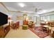 Large living room with ample seating, a ceiling fan, and natural light throughout at 517 Kingsdown Ct, Waxhaw, NC 28173
