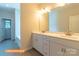 Bright bathroom features a double vanity with framed mirror and modern fixtures at 524 Hullview Vis, Monroe, NC 28110