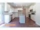 Spacious kitchen features stainless appliances, granite counters, ample cabinet space, and island with a sink at 524 Hullview Vis, Monroe, NC 28110