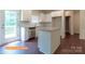 Well-equipped kitchen features stainless steel appliances and a granite island with a sink at 524 Hullview Vis, Monroe, NC 28110