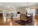 A living room displaying a ceiling fan, curtains, hardwood floors, and furniture at 56113 Finches Ct, Indian Land, SC 29707