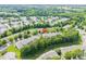 Aerial view of Skybrook Golf Club featuring mature trees and well-maintained townhouse community at 5963 Pale Moss Ln, Charlotte, NC 28269