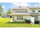 A view of the cozy covered patio and lush green backyard at 5963 Pale Moss Ln, Charlotte, NC 28269