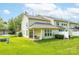 The house features a cozy covered patio and lush green backyard at 5963 Pale Moss Ln, Charlotte, NC 28269