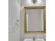 Bright bathroom featuring a gold framed mirror, white sink and white walls at 5963 Pale Moss Ln, Charlotte, NC 28269