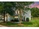 Charming two-story home with mature trees, a well-maintained lawn, and an attached garage at 5963 Pale Moss Ln, Charlotte, NC 28269