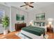 Spacious bedroom with hardwood floors, ceiling fan and decor to make you feel at home at 5963 Pale Moss Ln, Charlotte, NC 28269