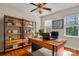 Office with hardwood floors, ceiling fan and a wooden bookshelf at 5963 Pale Moss Ln, Charlotte, NC 28269