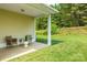 The backyard features a cozy covered patio with stylish outdoor seating at 5963 Pale Moss Ln, Charlotte, NC 28269