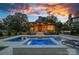 Backyard retreat featuring a luxurious pool, spa, and stylish outdoor seating area at 639 Edgemont Rd, Charlotte, NC 28211