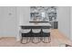 Chic bar area with marble backsplash, open shelving, and a wine cooler, perfect for entertaining at 639 Edgemont Rd, Charlotte, NC 28211