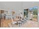 Open dining area featuring modern light fixture and view to the kitchen and exterior at 639 Edgemont Rd, Charlotte, NC 28211