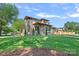 Expansive front lawn leading to an elegant, modern home with stone detailing and mature trees at 639 Edgemont Rd, Charlotte, NC 28211