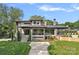 Stunning two-story home with stone accents, manicured lawn, and inviting entryway, showcasing modern design at 639 Edgemont Rd, Charlotte, NC 28211