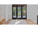 Welcoming foyer with natural light, hardwood floors, and a view of the home's exterior at 639 Edgemont Rd, Charlotte, NC 28211