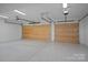 Spacious two-car garage with epoxy flooring and ample lighting at 639 Edgemont Rd, Charlotte, NC 28211