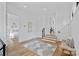 Bright hallway with hardwood floors and access to multiple rooms at 639 Edgemont Rd, Charlotte, NC 28211