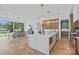 Open kitchen and dining area with modern island and hardwood floors at 639 Edgemont Rd, Charlotte, NC 28211