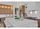 Spacious kitchen island with seating, modern lighting, and stainless steel appliances at 639 Edgemont Rd, Charlotte, NC 28211