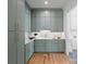 Bright laundry room with ample storage and modern appliances at 639 Edgemont Rd, Charlotte, NC 28211
