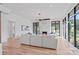 Elegant living room with a marble fireplace, hardwood floors, and expansive windows offering natural light at 639 Edgemont Rd, Charlotte, NC 28211