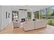 Bright living room with hardwood floors, a marble fireplace, and oversized windows with scenic views at 639 Edgemont Rd, Charlotte, NC 28211