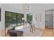Bright office with glass desk, modern lighting, and sliding doors to balcony at 639 Edgemont Rd, Charlotte, NC 28211