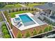 Aerial view of a luxurious pool and spa area with manicured landscaping, lounge chairs, and stylish outdoor living space at 639 Edgemont Rd, Charlotte, NC 28211