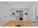 Spacious walk-in closet with custom shelving, ample storage space, and hardwood floors at 639 Edgemont Rd, Charlotte, NC 28211