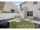 Private backyard with patio seating area, privacy fence, and manicured landscaping at 6834 Creft Cir, Indian Trail, NC 28079