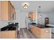 Well-lit kitchen featuring stainless steel appliances, black granite countertops, and wood cabinets at 6834 Creft Cir, Indian Trail, NC 28079