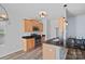 Modern kitchen with stainless steel appliances, dark countertops, and wooden cabinetry at 6834 Creft Cir, Indian Trail, NC 28079