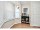 Cozy dining area with a large window, stylish lighting, and built-in shelving at 7526 Shadowstone Dr, Charlotte, NC 28270