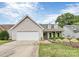 Charming home with a well-manicured front yard, two-car garage, and dormer windows at 7526 Shadowstone Dr, Charlotte, NC 28270