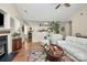 Comfortable living room featuring hardwood floors, a fireplace, and an open layout at 7526 Shadowstone Dr, Charlotte, NC 28270