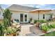 Charming outdoor patio with comfortable seating and lush plantings at 7526 Shadowstone Dr, Charlotte, NC 28270
