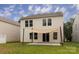 Backyard view with an installed sunshade and a sliding glass door providing easy access at 7623 Monarch Birch Ln, Charlotte, NC 28215