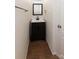 Bathroom features a dark wood vanity and updated fixtures at 7623 Monarch Birch Ln, Charlotte, NC 28215