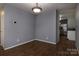 Cozy dining area with wood-look floors, neutral paint, and access to the kitchen at 7623 Monarch Birch Ln, Charlotte, NC 28215