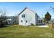 Spacious backyard features green grass and a simple two-story home with light gray siding at 81 Kirk St, Salisbury, NC 28144