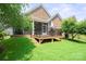 Backyard view of deck and screened porch at 8232 Bretton Woods Dr, Charlotte, NC 28227