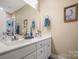 Bright bathroom features double sinks, quartz countertop, and neutral walls at 8232 Bretton Woods Dr, Charlotte, NC 28227