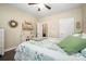 Neutral bedroom shows a bed with accent pillows, bedside table, and wood-look flooring at 8232 Bretton Woods Dr, Charlotte, NC 28227
