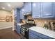 Kitchen featuring blue cabinets, white countertop, and stainless steel appliances at 8232 Bretton Woods Dr, Charlotte, NC 28227